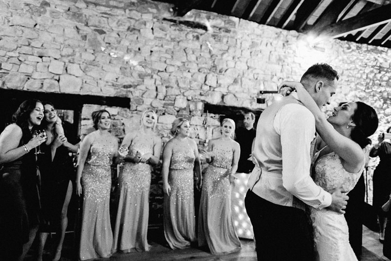 Romantic first dance at Pencoed House Estate wedding in Bridgend Wedding Photographer with bridesmaids watching on
