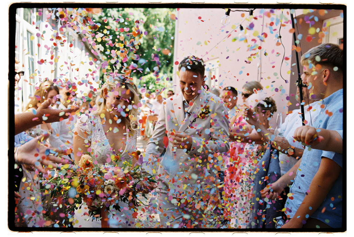 Wedding guest lovers on black and white analogue film