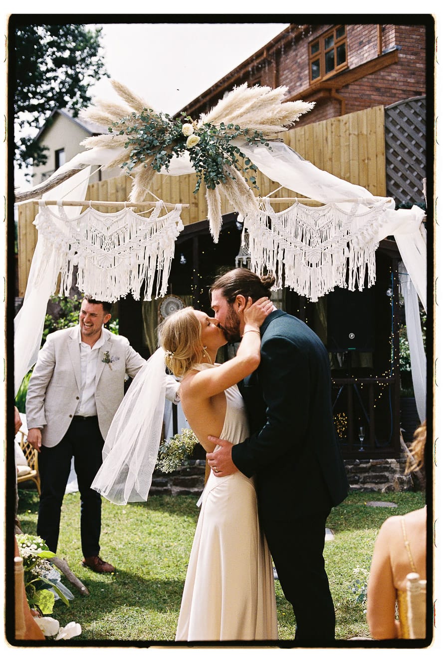 Outdoor wedding in Wales on film first kiss